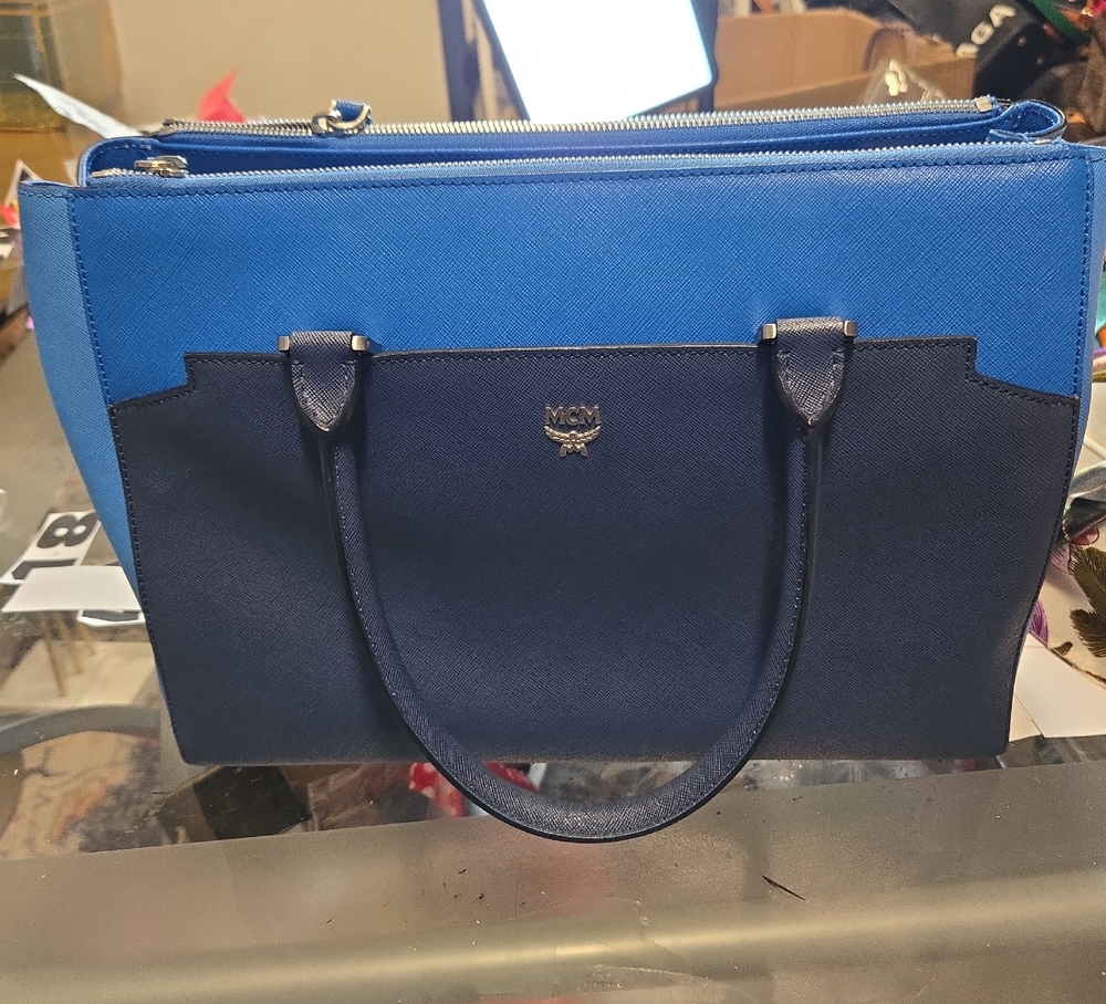 MCM TOTE. BUY TRU JULY QND GET A FREE ENTRY FOR THE NEVERFULL GOVEAWAY
